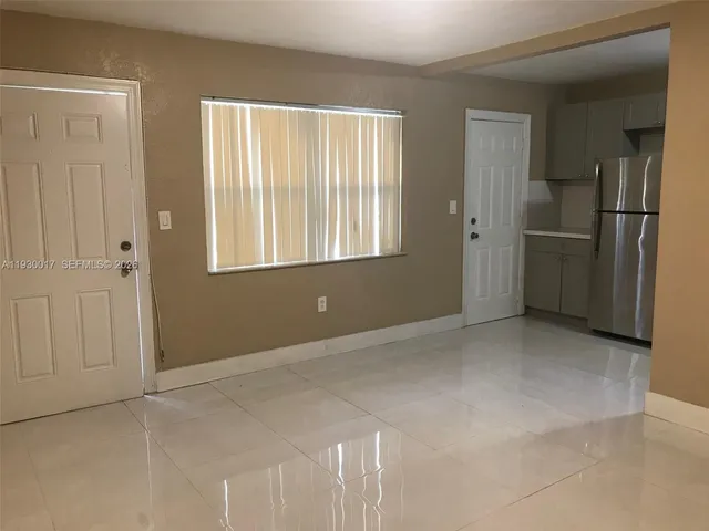 a bathroom with a sink a shower and vanity