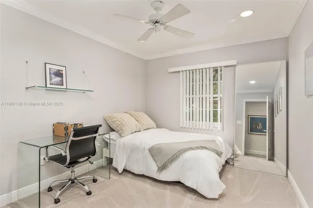 a bedroom with a bed and a chair