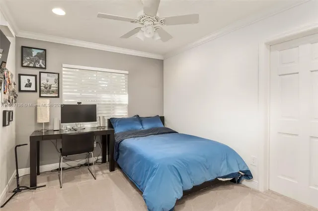 a bedroom with a workspace