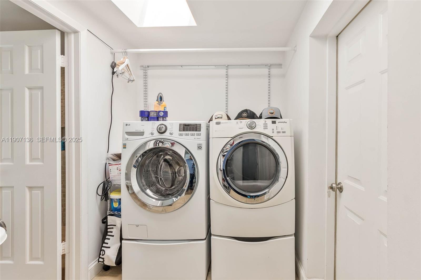 9240 Southwest 69th Court Pinecrest, FL 33156 - Photo 19 of 32 a utility room with dryer and washer