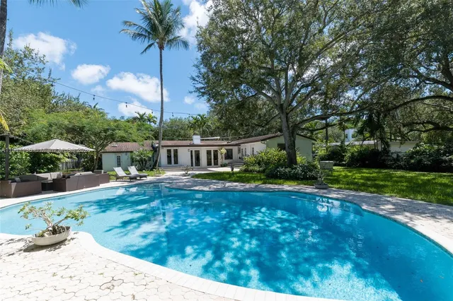 a view of a swimming pool with a patio