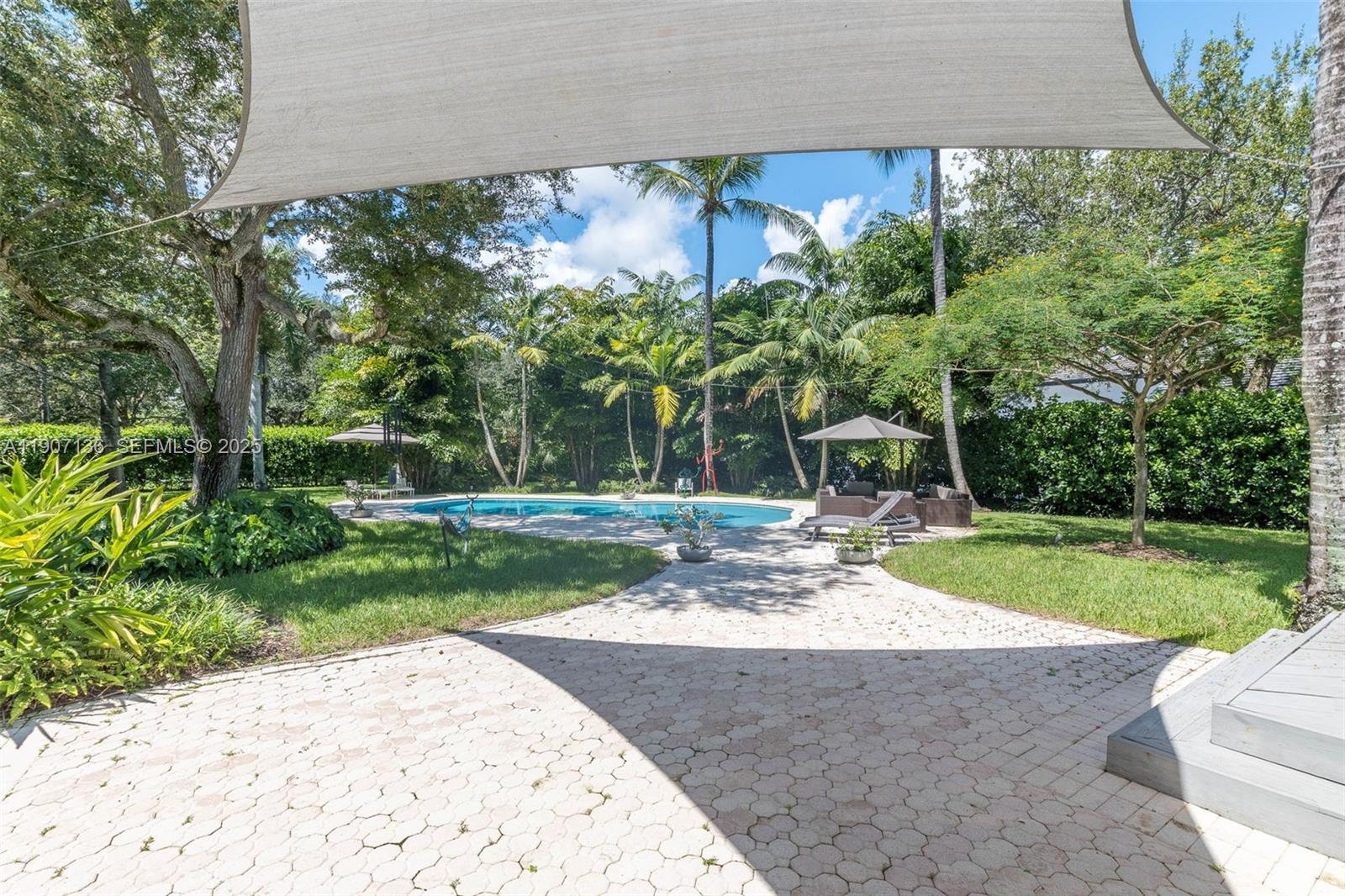 9240 Southwest 69th Court Pinecrest, FL 33156 - Photo 22 of 32 a view of a park with plants and trees