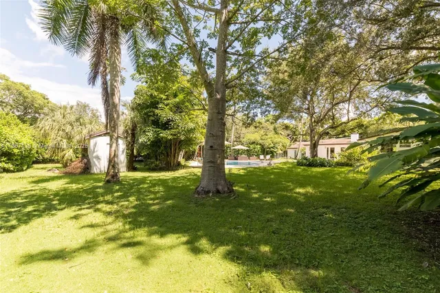 a view of outdoor space with deck and trees