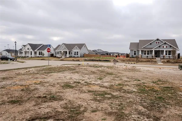 a view of houses with outdoor space and lakeside