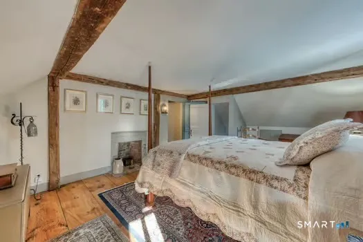 a bedroom with a bed and a table