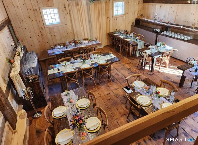 a view of a dining table and chairs in a patio