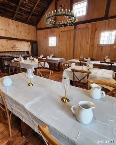 a kitchen with a table chairs and couches