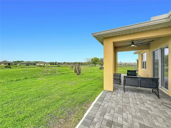 a view of a patio with a yard