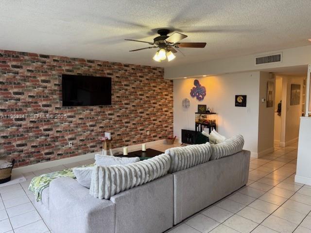 8401 West Sample Road, Unit 14 Coral Springs, FL 33065 - Photo 2 of 32 a living room with furniture and a flat screen tv