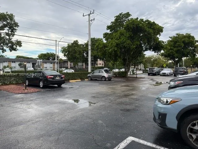 a view of a backyard with a car parked
