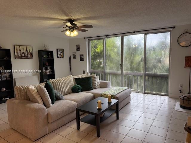8401 West Sample Road, Unit 14 Coral Springs, FL 33065 - Photo 3 of 32 a living room with furniture and a large window with outer view