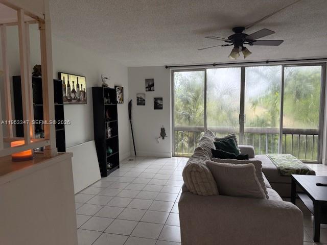 8401 West Sample Road, Unit 14 Coral Springs, FL 33065 - Photo 4 of 32 a living room with furniture and a large window