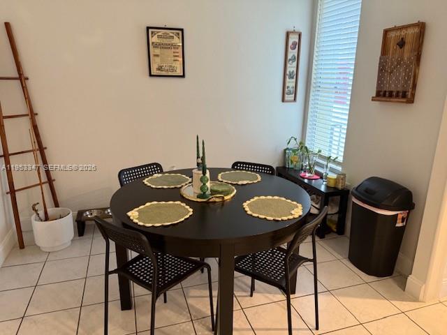 8401 West Sample Road, Unit 14 Coral Springs, FL 33065 - Photo 8 of 32 a view of a dining room with furniture and wooden floor