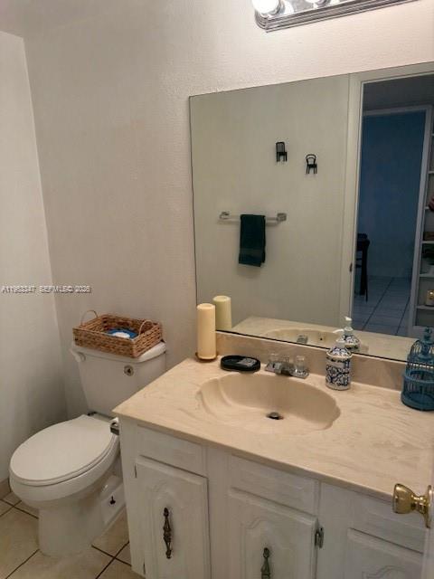 8401 West Sample Road, Unit 14 Coral Springs, FL 33065 - Photo 9 of 32 a bathroom with a sink toilet and mirror