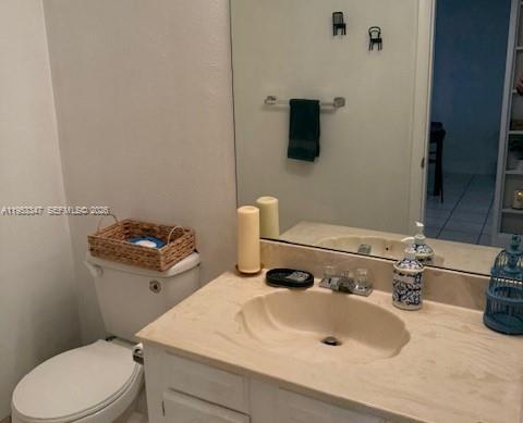 8401 West Sample Road, Unit 14 Coral Springs, FL 33065 - Photo 10 of 32 a bathroom with a sink and a toilet