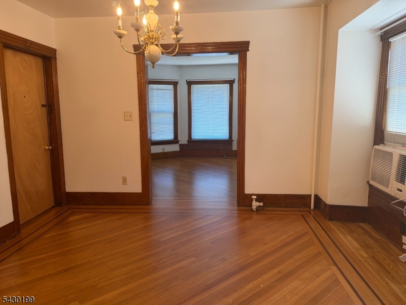 72 Baldwin Place, Unit 2 Bloomfield, NJ 07003 - Photo 12 of 24 a view of a room with wooden floor and a large window