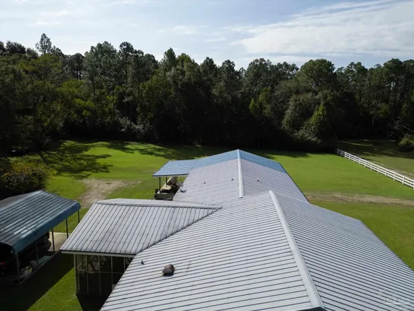 a view of a swimming pool with a yard