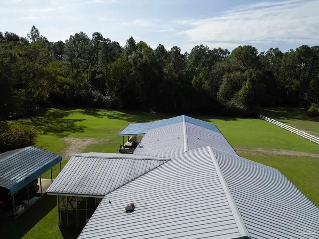 a view of a swimming pool with a yard