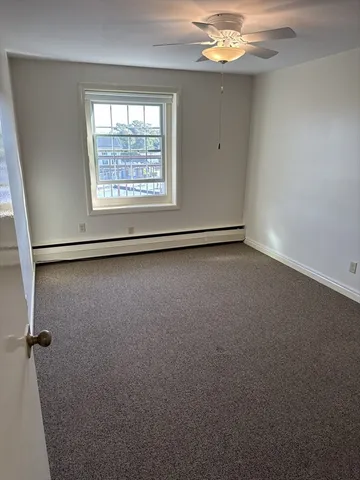 an empty room with a mirror