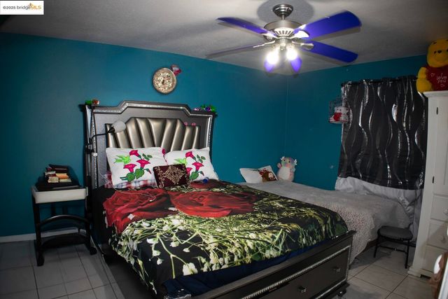 a bathroom with a toilet and a mirror