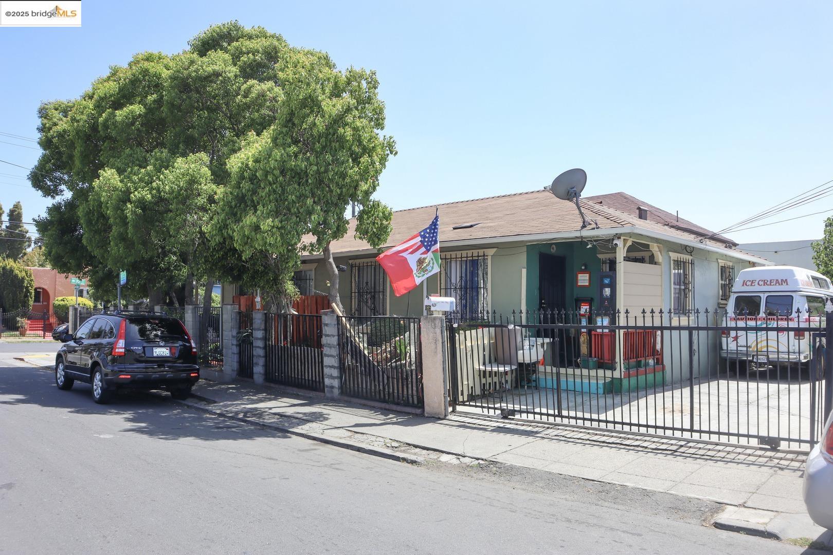6921 Flora Street Oakland, CA 94621 - Photo 5 of 22 a car parked in front of a house