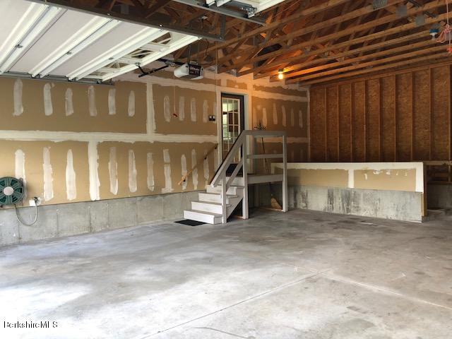 525 W Road Clarksburg, MA 01247 - Photo 19 of 23 a view of an empty room with a staircase