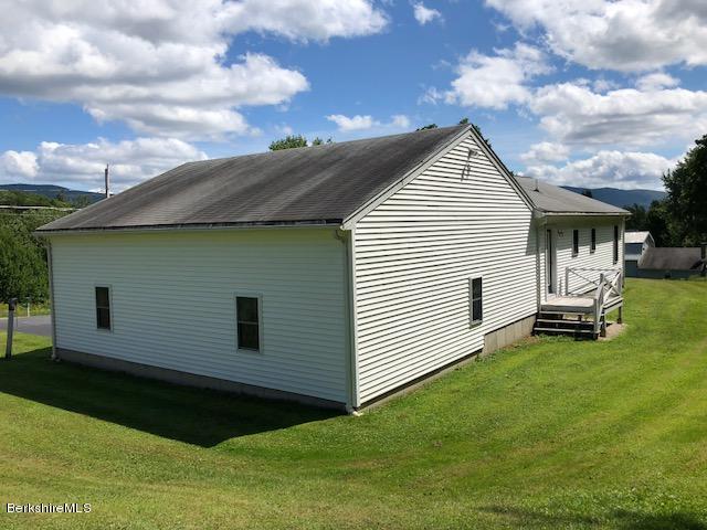 525 W Road Clarksburg, MA 01247 - Photo 22 of 23 a view of a white house with a yard
