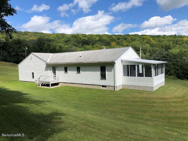 525 W Road Clarksburg, MA 01247 - Photo 23 of 23 a view of a white house with a big yard and large tree