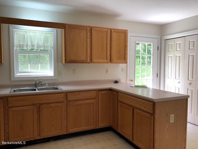 525 W Road Clarksburg, MA 01247 - Photo 4 of 23 a kitchen with sink cabinets and window