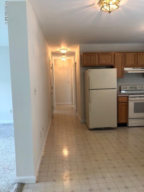 525 W Road Clarksburg, MA 01247 - Photo 5 of 23 a view of a hallway with washer and dryer