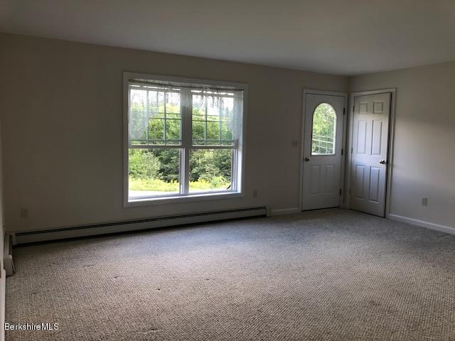 525 W Road Clarksburg, MA 01247 - Photo 7 of 23 an empty room with windows and an empty room
