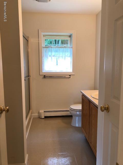 525 W Road Clarksburg, MA 01247 - Photo 8 of 23 a bathroom with a toilet sink and window
