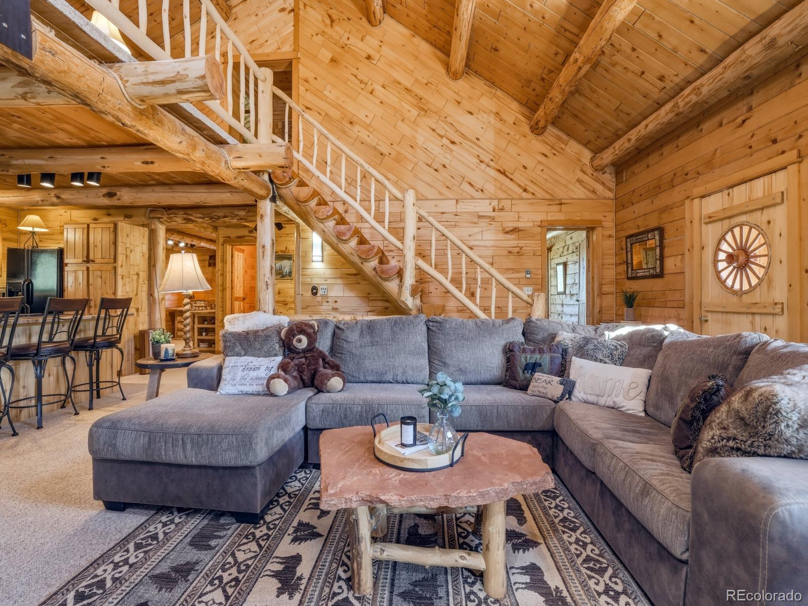 341 Anderson Road Walden, CO 80480 - Photo 22 of 50 a living room with furniture and a rug