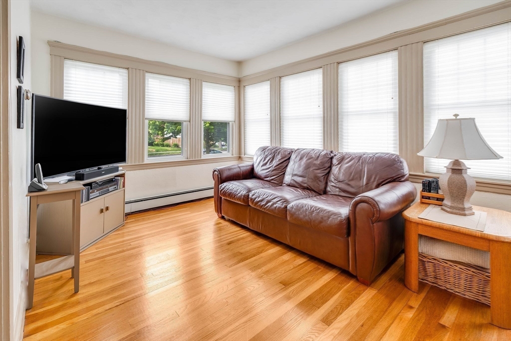 223 Lawrence Road Medford, MA 02155 - Photo 13 of 40 a living room with furniture and a flat screen tv