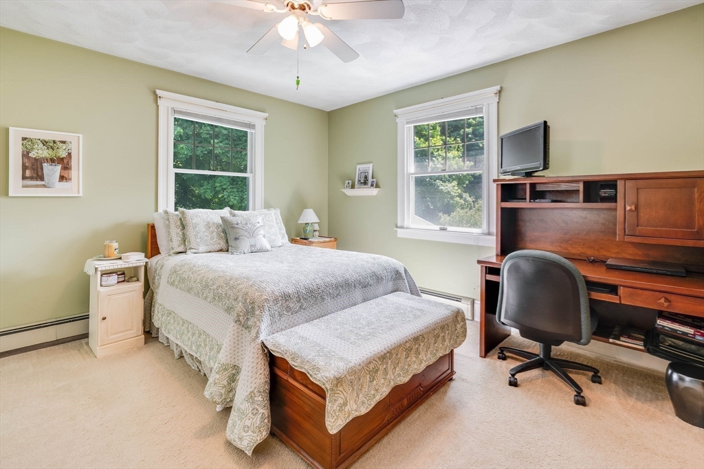 223 Lawrence Road Medford, MA 02155 - Photo 16 of 40 a bedroom with a bed and a desk