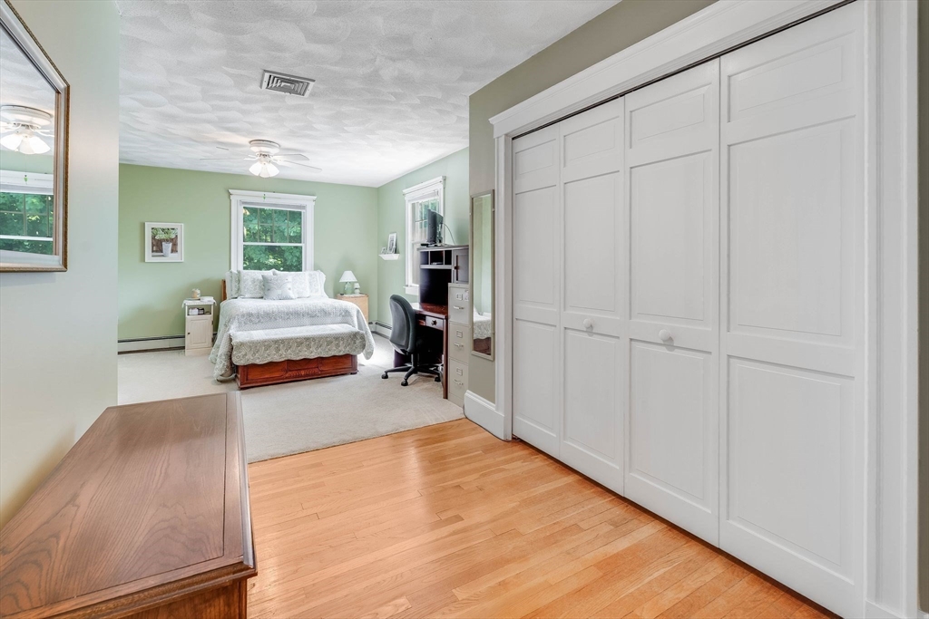 223 Lawrence Road Medford, MA 02155 - Photo 18 of 40 a view of a livingroom with furniture and wooden floor