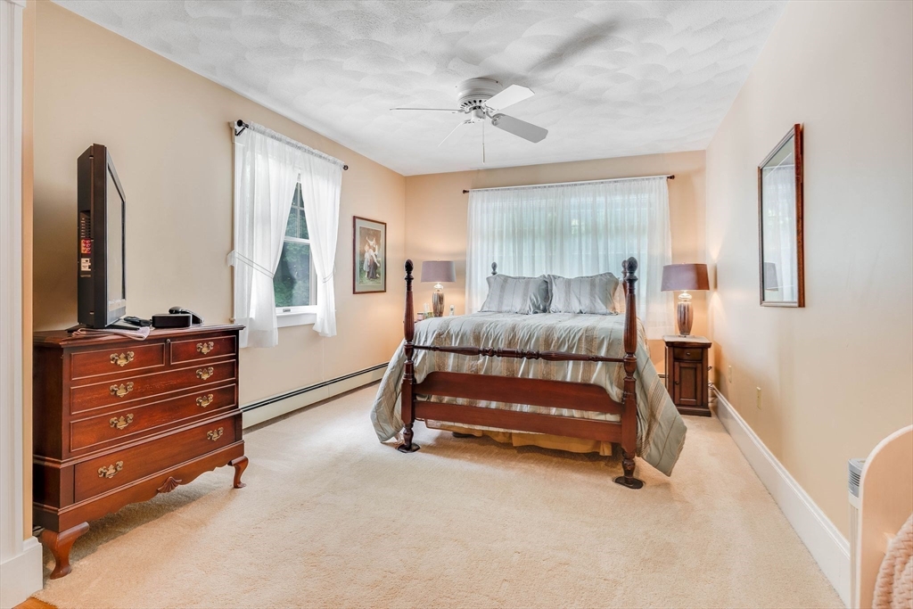 223 Lawrence Road Medford, MA 02155 - Photo 21 of 40 a bedroom with a bed and a dresser