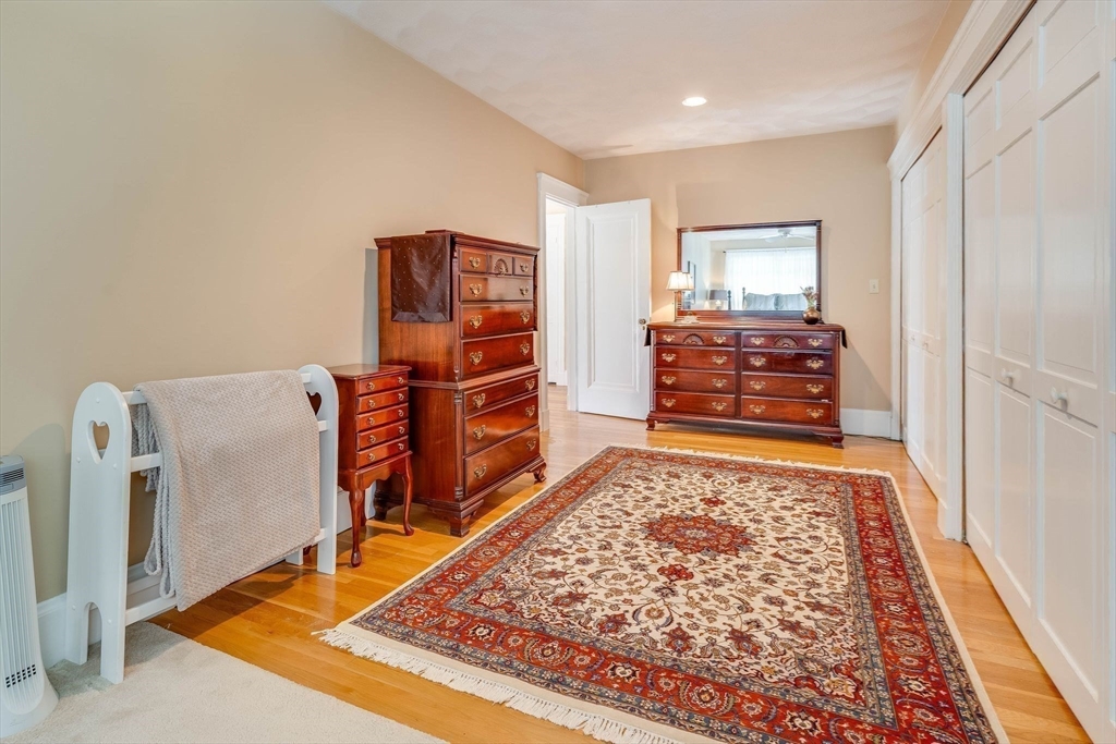 223 Lawrence Road Medford, MA 02155 - Photo 22 of 40 a living room with furniture and a rug