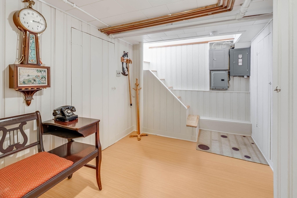 223 Lawrence Road Medford, MA 02155 - Photo 25 of 40 a view of a hallway with paintings on the wall