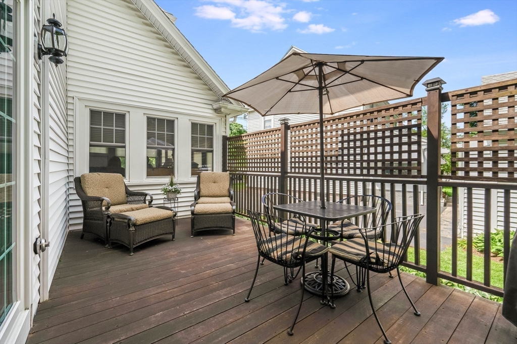 223 Lawrence Road Medford, MA 02155 - Photo 28 of 40 a view of a patio with a table and chairs