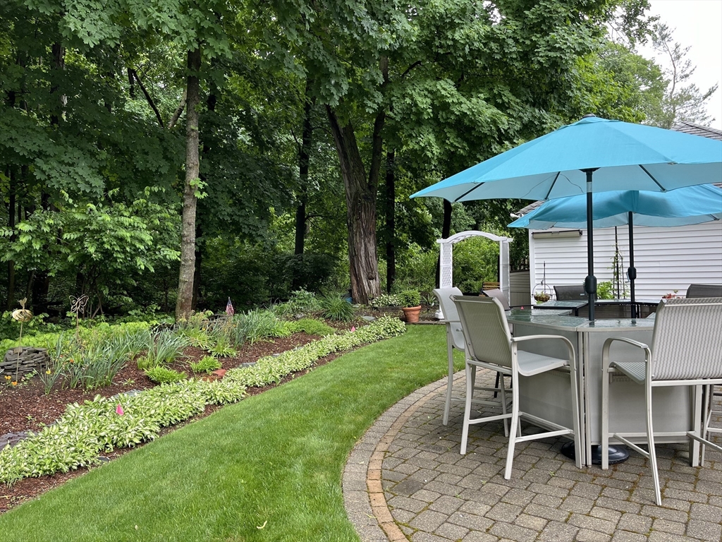 223 Lawrence Road Medford, MA 02155 - Photo 30 of 40 a table and chairs in the garden