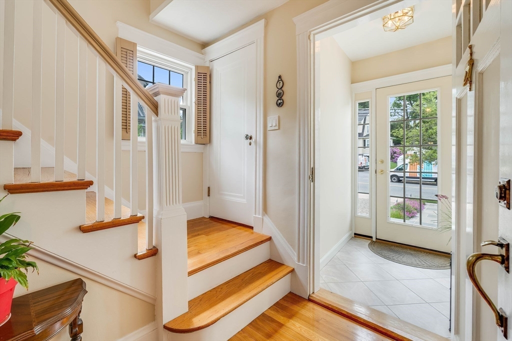 223 Lawrence Road Medford, MA 02155 - Photo 3 of 40 a view of an entryway with wooden floor and door