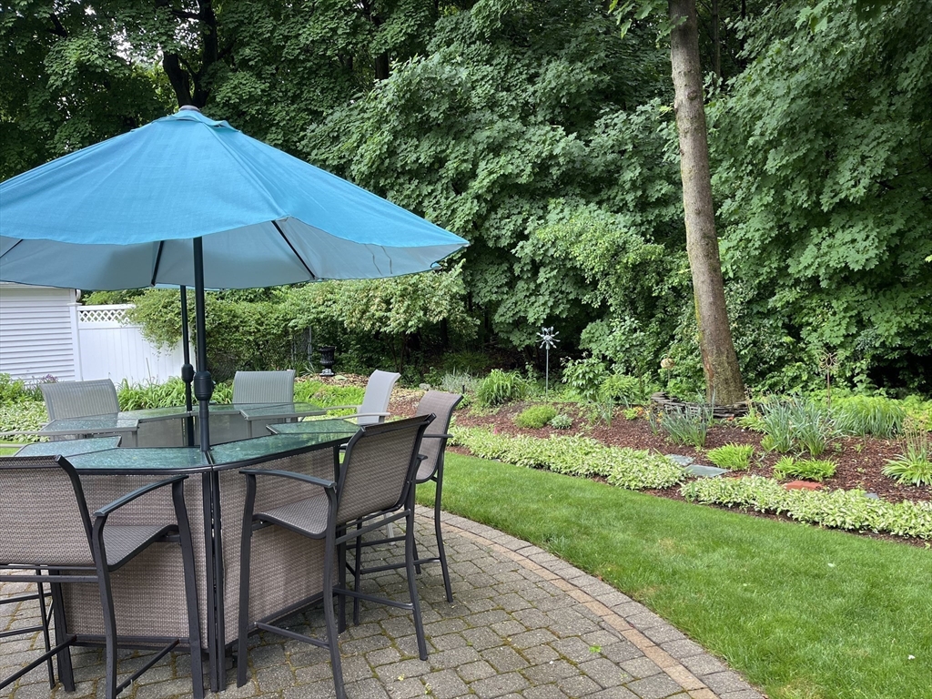 223 Lawrence Road Medford, MA 02155 - Photo 32 of 40 a view of backyard with seating space and garden