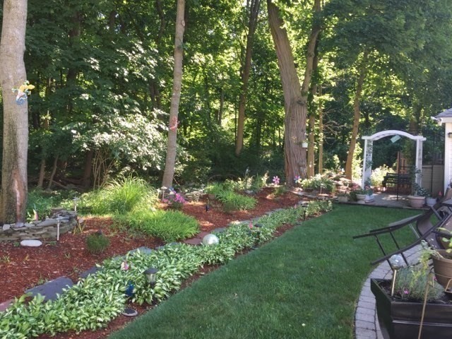 223 Lawrence Road Medford, MA 02155 - Photo 34 of 40 a view of a chair and tables in the garden