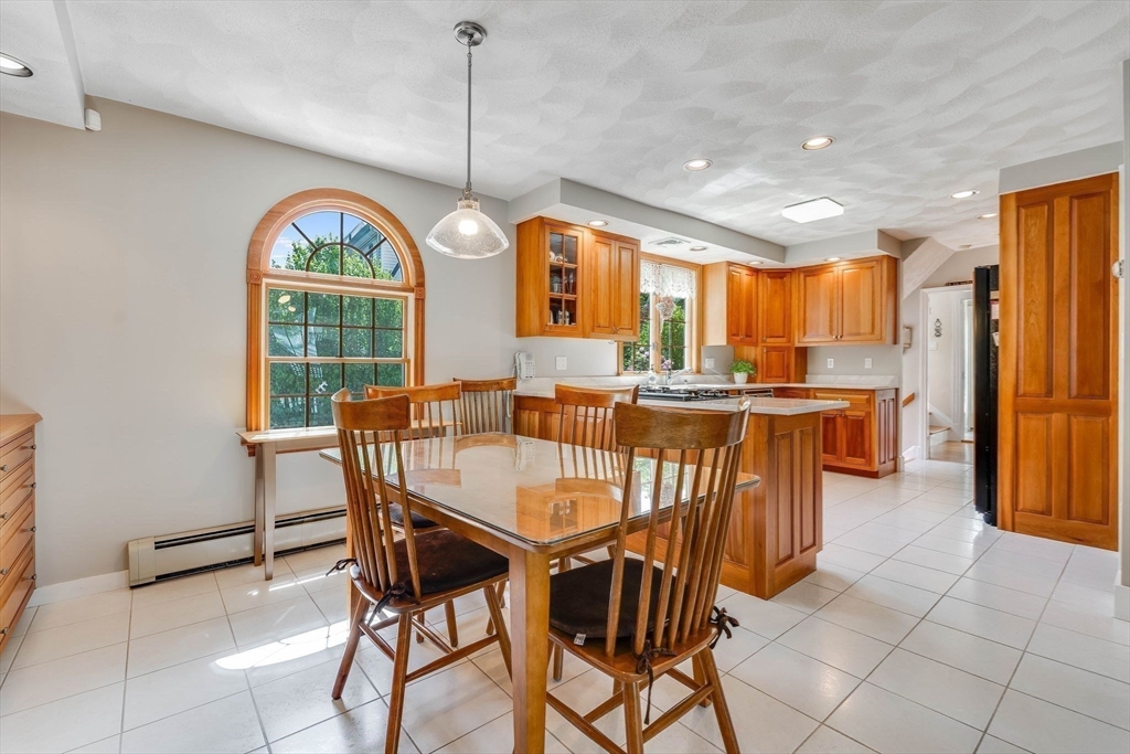223 Lawrence Road Medford, MA 02155 - Photo 5 of 40 a dining room with furniture a chandelier and window