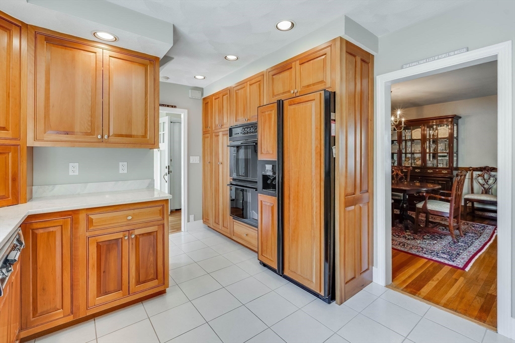 223 Lawrence Road Medford, MA 02155 - Photo 6 of 40 a kitchen with stainless steel appliances granite countertop a refrigerator and a sink