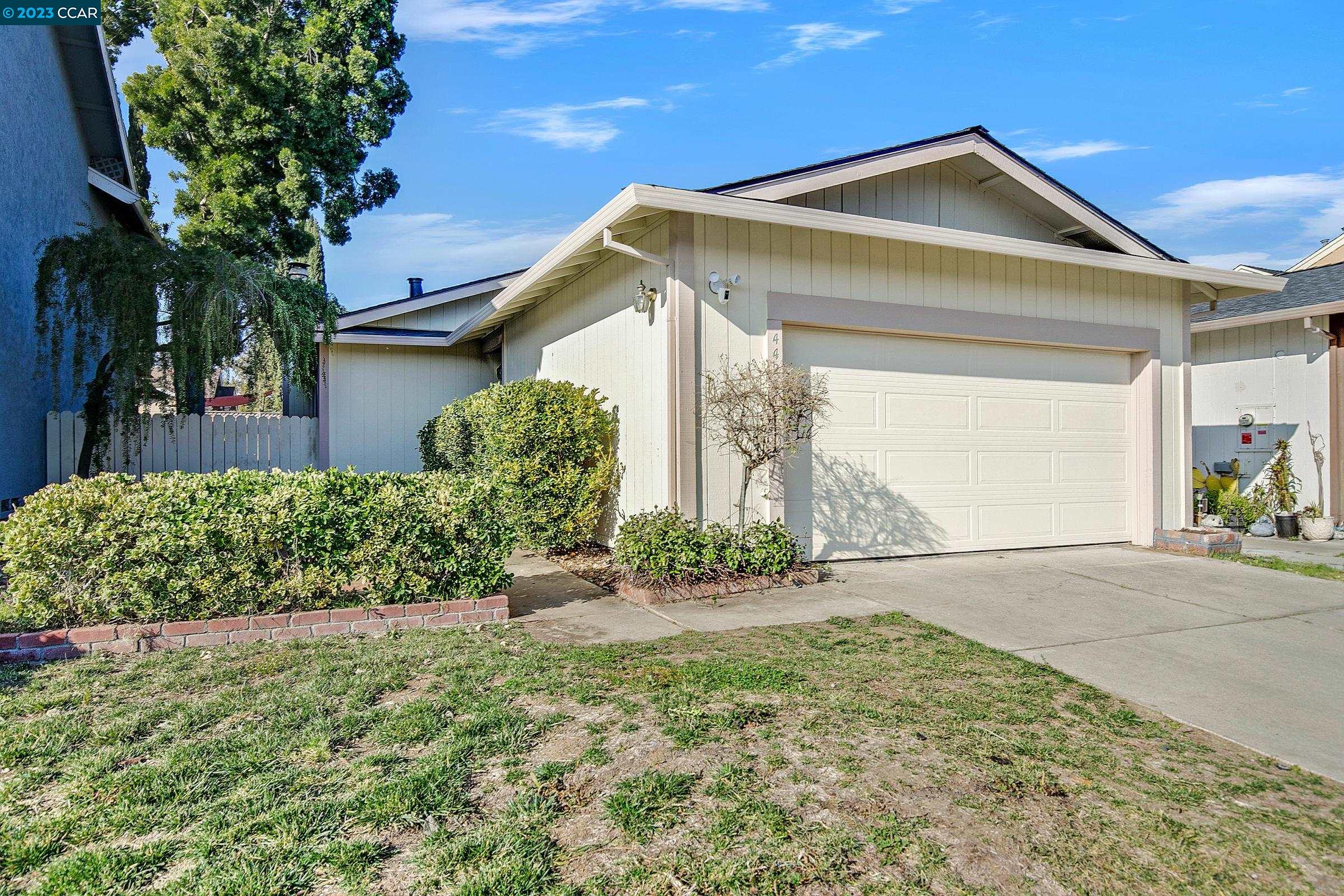 4425 Macadamia Lane Oakley, CA 94561 - Photo 1 of 1 a front view of a house with a yard