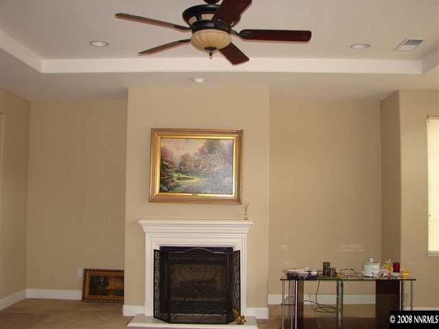 8105 Willow Ranch Trail Reno, NV 89523 - Photo 3 of 9 a living room with furniture and a fireplace