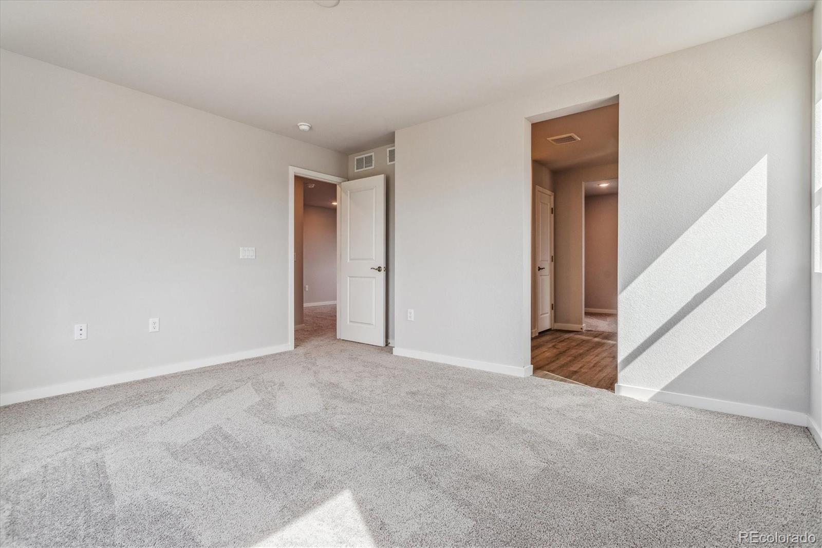4255 Gozzer Ranch Drive Elizabeth, CO 80107 - Photo 16 of 21 a view of an empty room with stairs