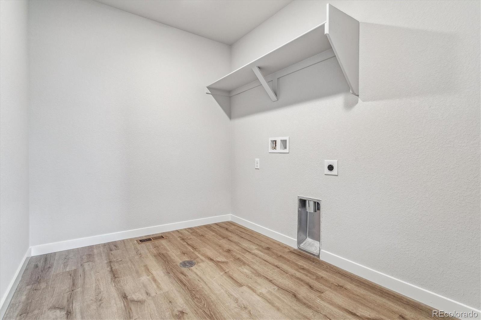 4255 Gozzer Ranch Drive Elizabeth, CO 80107 - Photo 20 of 21 a view of empty room with wooden floor